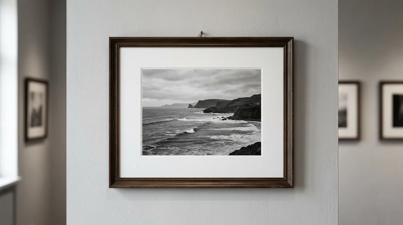 Close-up of framed photograph on gallery wall, artistic composition with natural lighting and depth of field